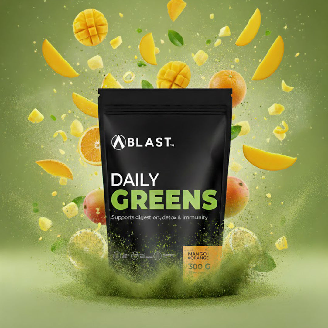 Bag of 'Blast Daily Greens' with mango and orange slices on a green background
