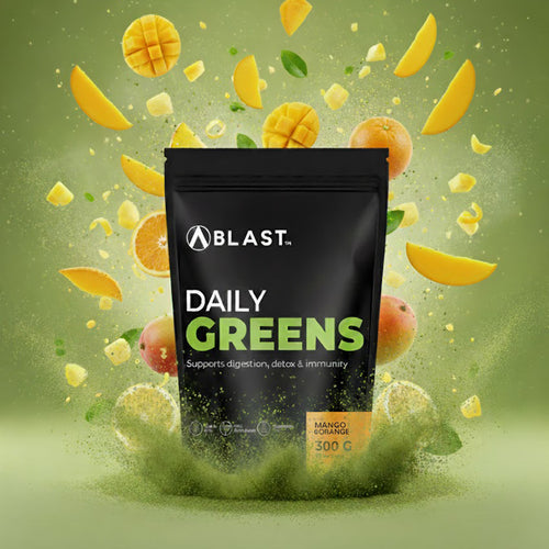 Bag of 'Blast Daily Greens' with mango and orange slices on a green background