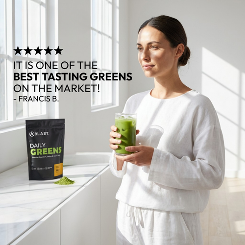 Blast Greens Testimonial.  Lady holding glass and happy