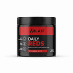A black plastic jar of BLAST Daily Reds supplement powder with a red and white label, set against a plain white background.